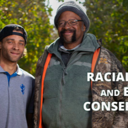 Two men stand together outdoors near trees with the text Racial Justice and Equity Conservation Cooperative Agreements, highlighting a USDA program supporting equity and rural funding in conservation efforts.