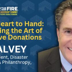 Smiling man in suit stands next to text highlighting the wildfire leadership summit and mastering effective donations.