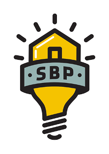 Yellow light bulb shaped like a house with “SBP” on a gray banner across the middle, radiating lines above.